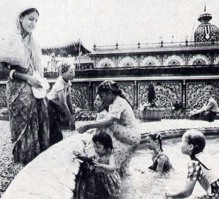 Hare Krsna Devotees Cool Off in Fountain in The Garden at Palace Of Gold